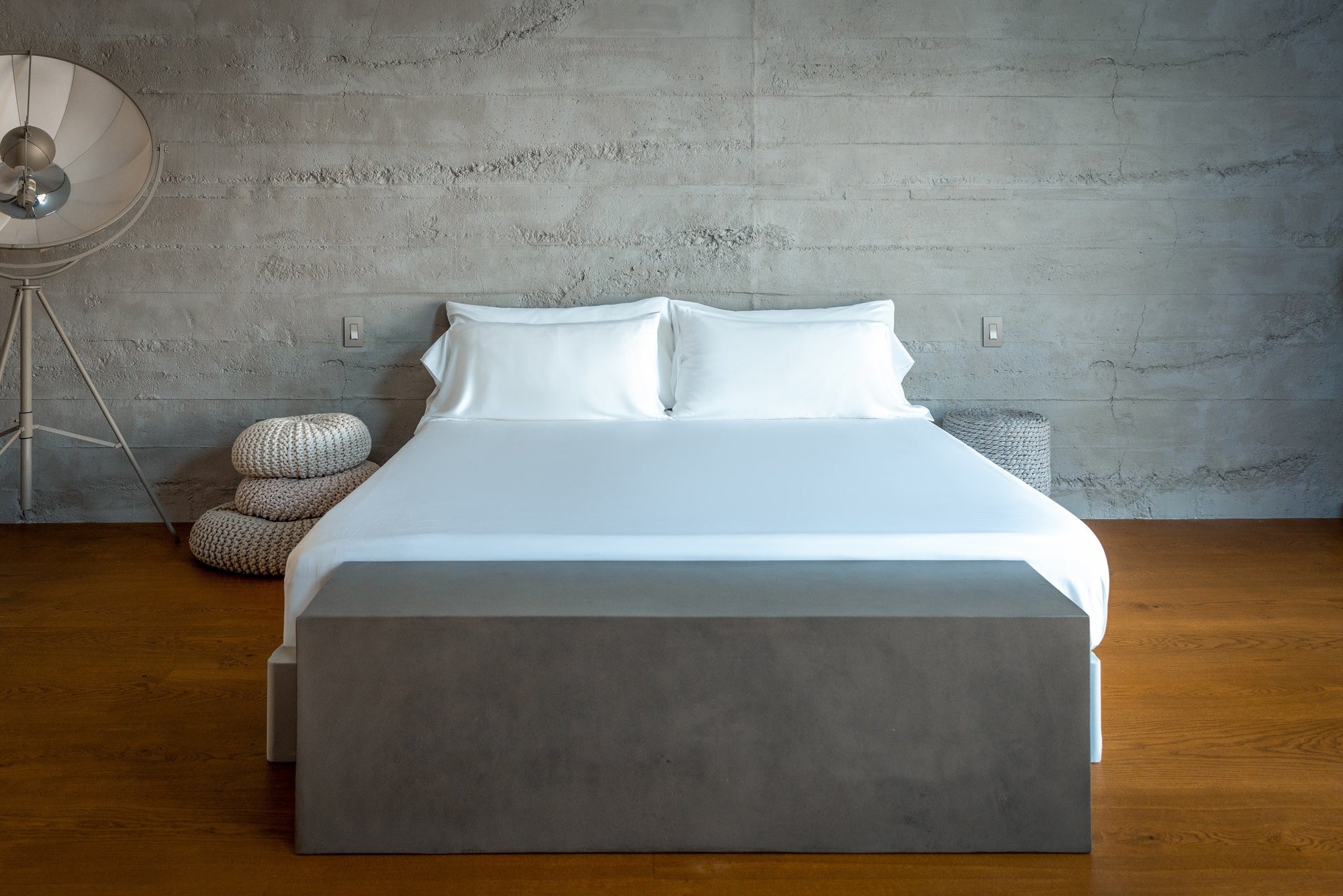 A bed is made with breathable, cooling eucalyptus sheets in a modern, eco-friendly house in Florida.